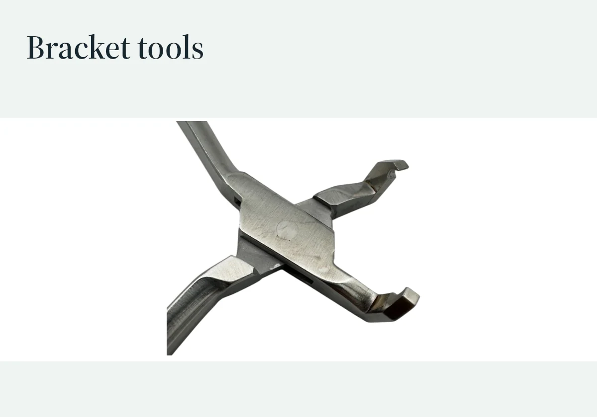 Close-up of bracket-removal plier tips, showing their working-end geometry.