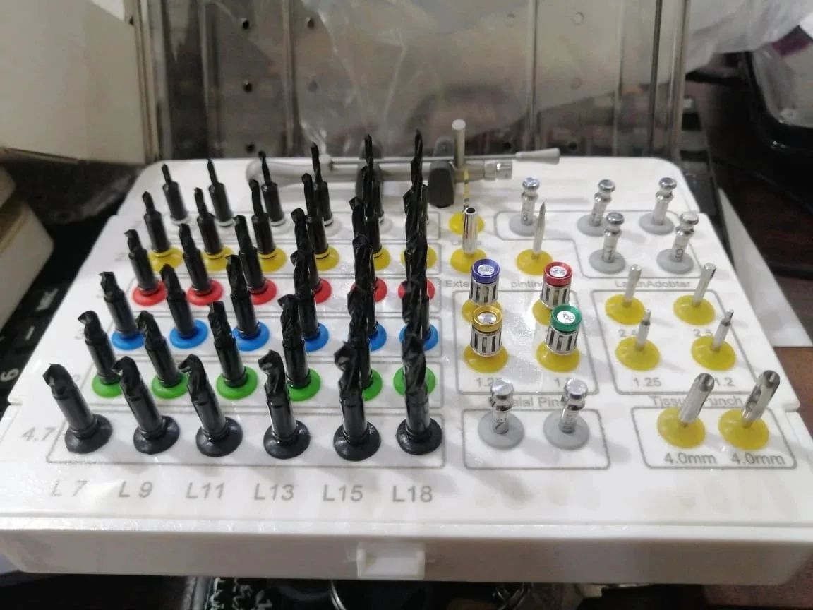 Implant surgical drill and accessory assortment in its case, view 1