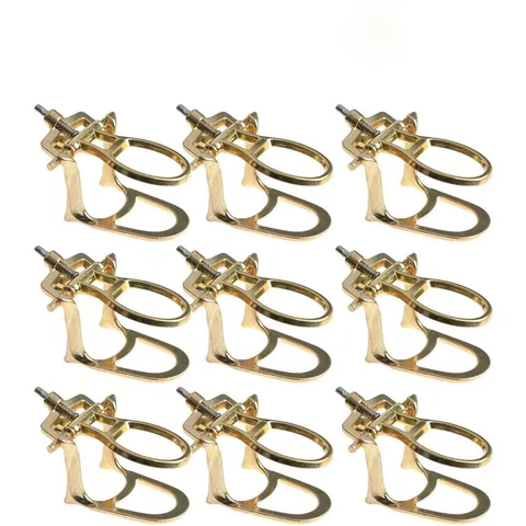 Repeated gold-coloured dental articulator frames with adjustment hardware