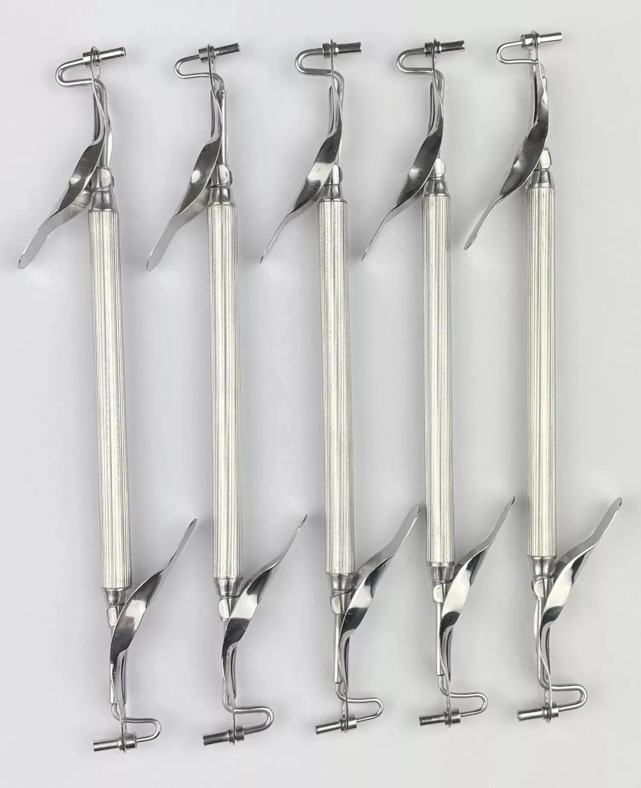 Double-ended amalgam carrier showing barrel and plunger details — view 1