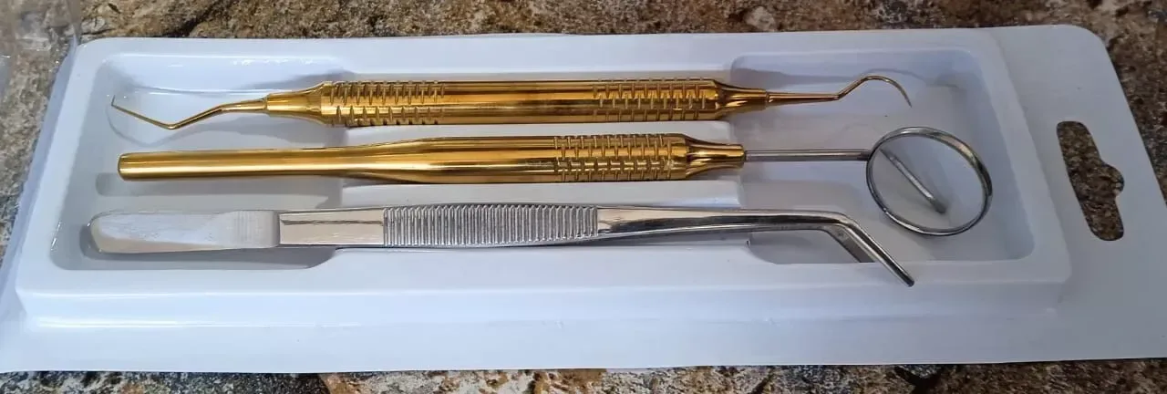 Three-piece dental examination kit with mirror, explorer and angled cotton tweezers — view 1